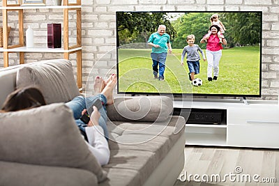 Woman Watching Television Stock Photo