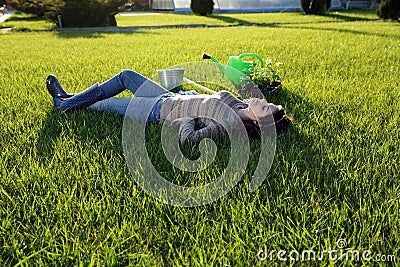 Woman lying on green grass Stock Photo