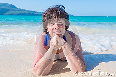 Woman lying in the sea Stock Photo