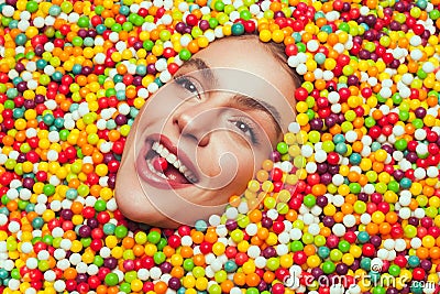 Woman lying on sweets Stock Photo
