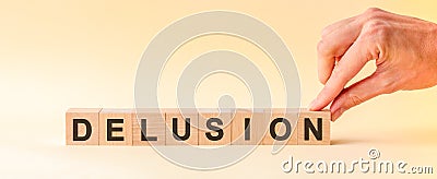 Woman made word delusion with wood blocks Stock Photo