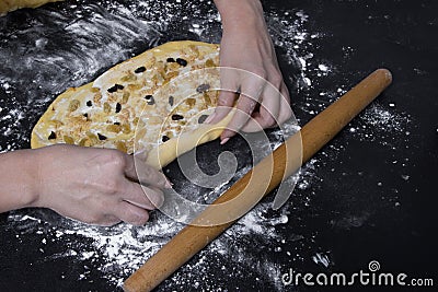 Woman make sweet homemade backery on black table Stock Photo