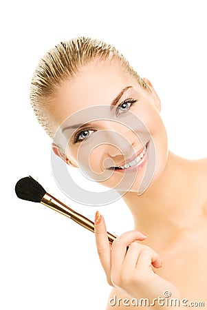 Woman with a make-up brush Stock Photo