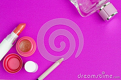 Woman Make Up Cosmetics On Purple Background Stock Photo