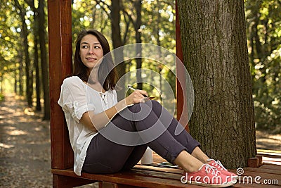 Woman makes notes on a pad Stock Photo