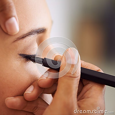 Woman, makeup and eyeliner with eye pencil for beauty, cosmetics or art at salon or spa. Closeup of female person or Stock Photo