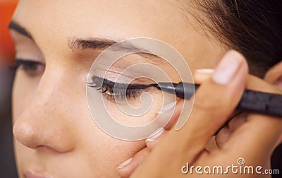 Woman, makeup and eyeliner with mascara for beauty, cosmetics or art at salon or spa. Closeup of female person or Stock Photo