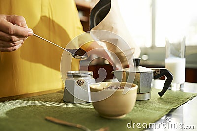 Woman making coffee with moka pot Stock Photo