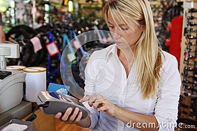 Woman making debit payment Stock Photo