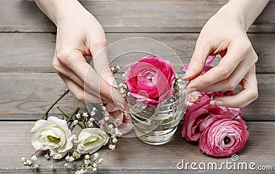 Woman making floral wedding decorations Stock Photo