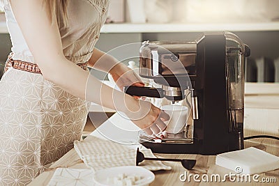 Woman making fresh espresso in coffee maker. coffee machine make Stock Photo