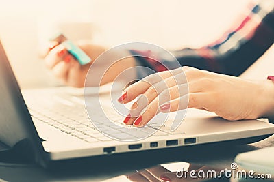 Woman making online payment with credit card Stock Photo