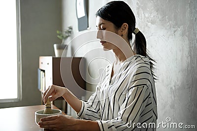 Woman making oriental green tea Japanese ceremony Stock Photo