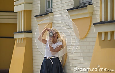 Woman is making photo on old camera Stock Photo