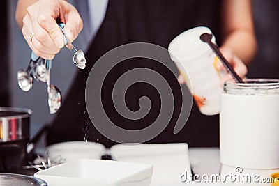 Woman during making pour measure dough Stock Photo