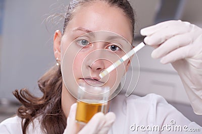 Woman making urine test Stock Photo