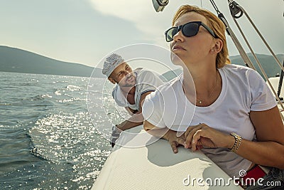 Woman and man aboard yacht, beautiful seascape Stock Photo