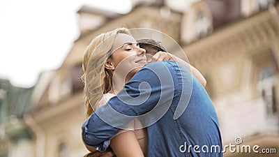 Woman and man embracing tenderly, sweet relationship of couple in love, date Stock Photo