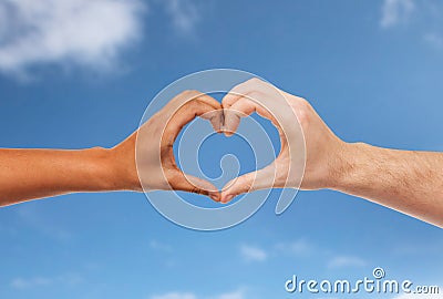 Woman and man hands making heart symbol Stock Photo