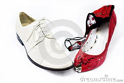 Woman and man shoes with woman panties on it. Stock Photo