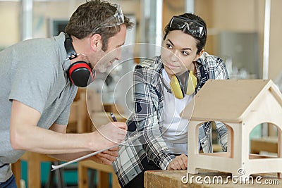 woman and man wooden working Stock Photo