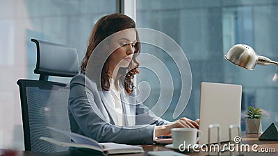 Woman manager corresponding client using laptop sitting luxury office close up. Stock Photo