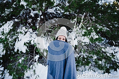 Young beautiful woman covered in blanket at the mountain. Relax and nature Stock Photo
