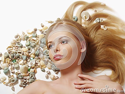 woman with marine cockleshell in hair Stock Photo