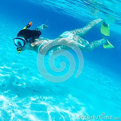 Woman with mask snorkeling Stock Photo