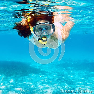 Woman with mask snorkeling Stock Photo