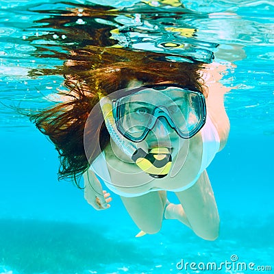 Woman with mask snorkeling Stock Photo