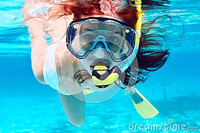 Woman with mask snorkeling Stock Photo