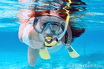 Woman with mask snorkeling Stock Photo