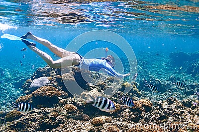 Woman with mask snorkeling Stock Photo