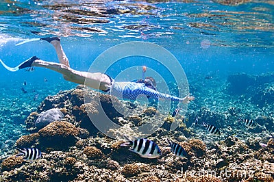 Woman with mask snorkeling Stock Photo