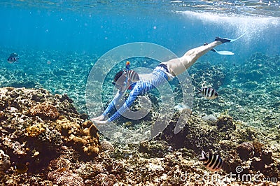 Woman with mask snorkeling Stock Photo