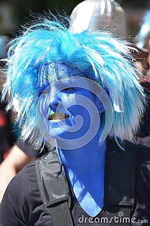 A woman masked in blue at the peoples` carnival in Kreuzberg, Berlin in July 2015 Editorial Stock Photo