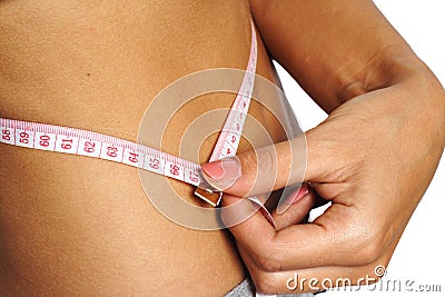 Woman measure her waist belly metre-stick Stock Photo