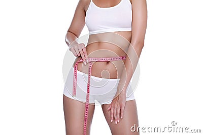 Woman and measure tape around her body Stock Photo