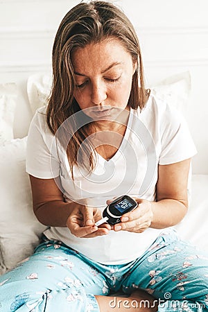 Measurnig blood sugar level Stock Photo