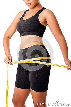 Woman measuring size of thigh Stock Photo