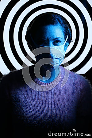 Woman Medical Face Mask Covid-19 Coronavirus Hypnotic Spiral Stock Photo