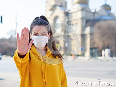 Woman in medical mask, making stop it there Stock Photo