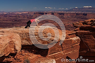 Woman meditating doing yoga in Canyonlands National park in Utah Stock Photo