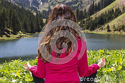 Woman meditating in nature Stock Photo