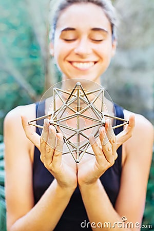 Woman meditating on sacred geometry Stock Photo