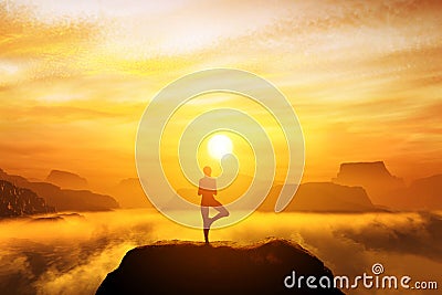 Woman meditating in tree yoga position Stock Photo