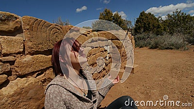 Woman Meditating Under an Ancient Spiral Stock Photo