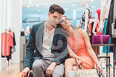 Woman and men being tired from shopping fashion Stock Photo