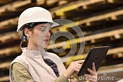 Woman metal worker using tablet Stock Photo